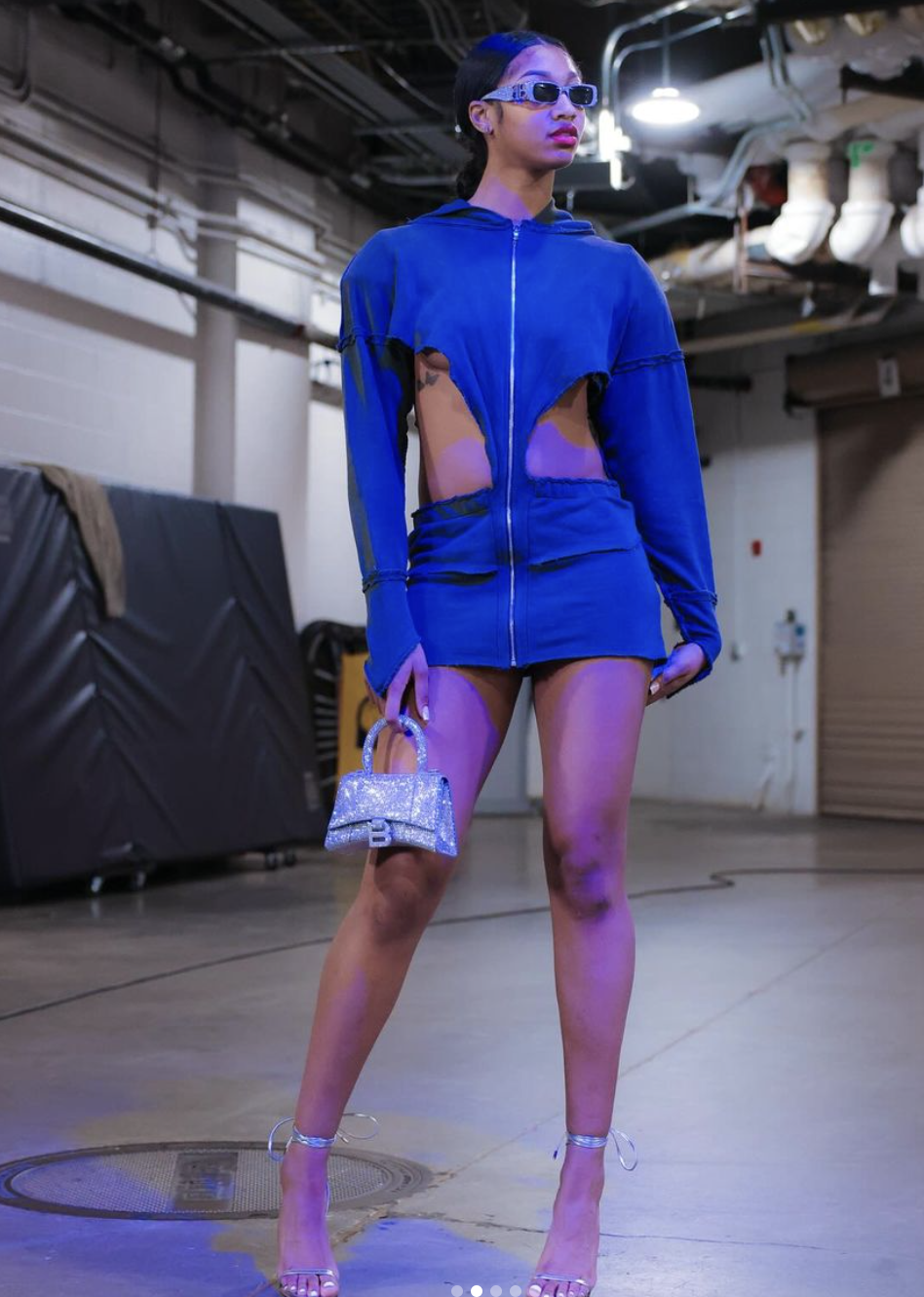 Chicago Sky star Angel Reese rocked a sky blue fit with strategic cutouts ahead of the highly-anticipated (and ultimately controversial) game against the Indianapolis Fever. 