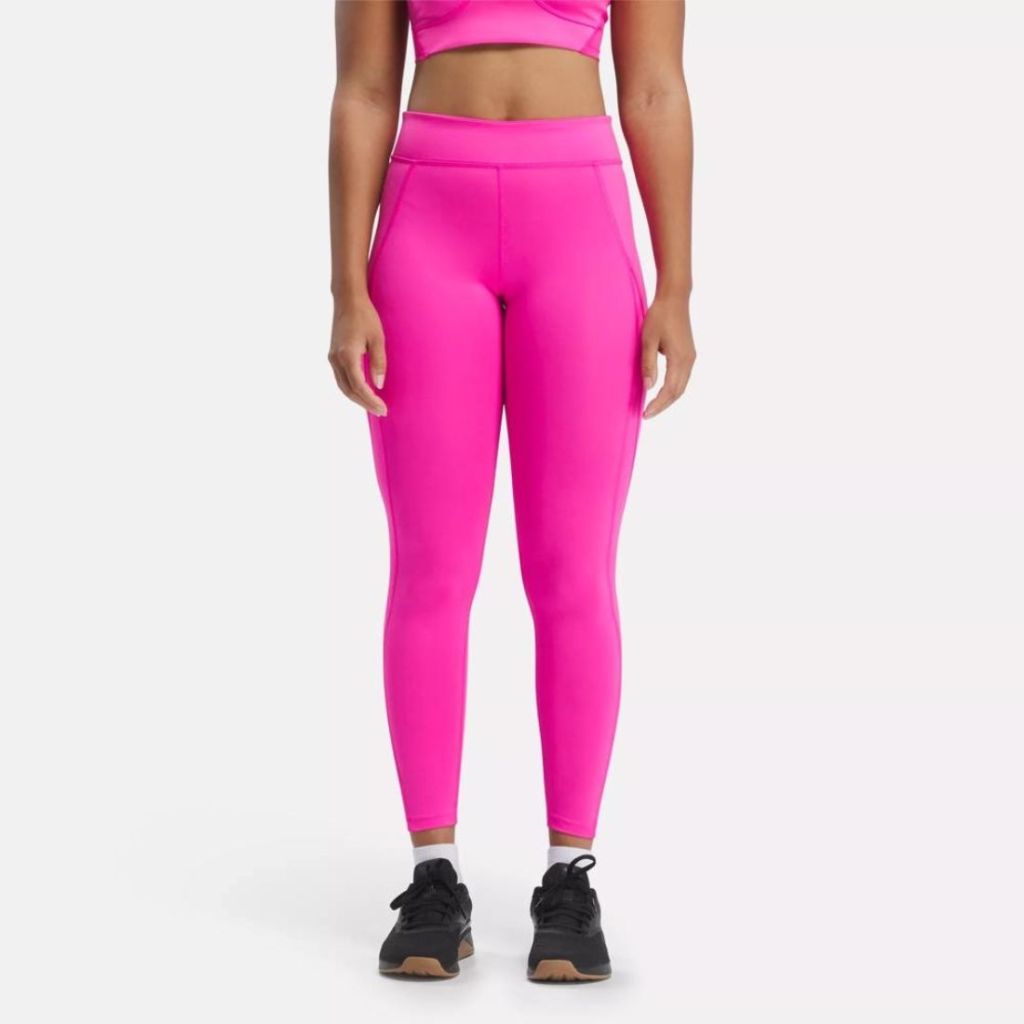 model wearing hot pink leggings and matching crop top