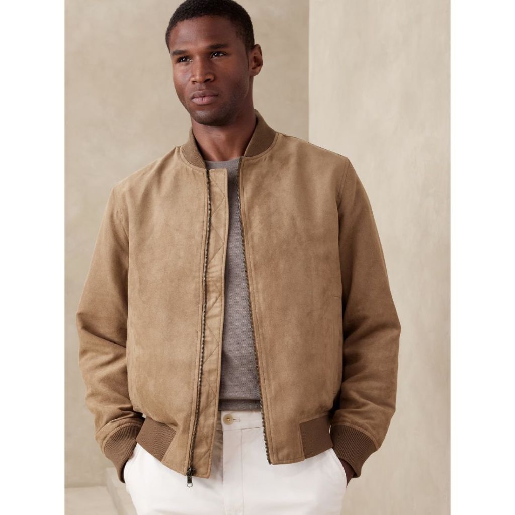 model wearing brown vegan suede bomber jacket