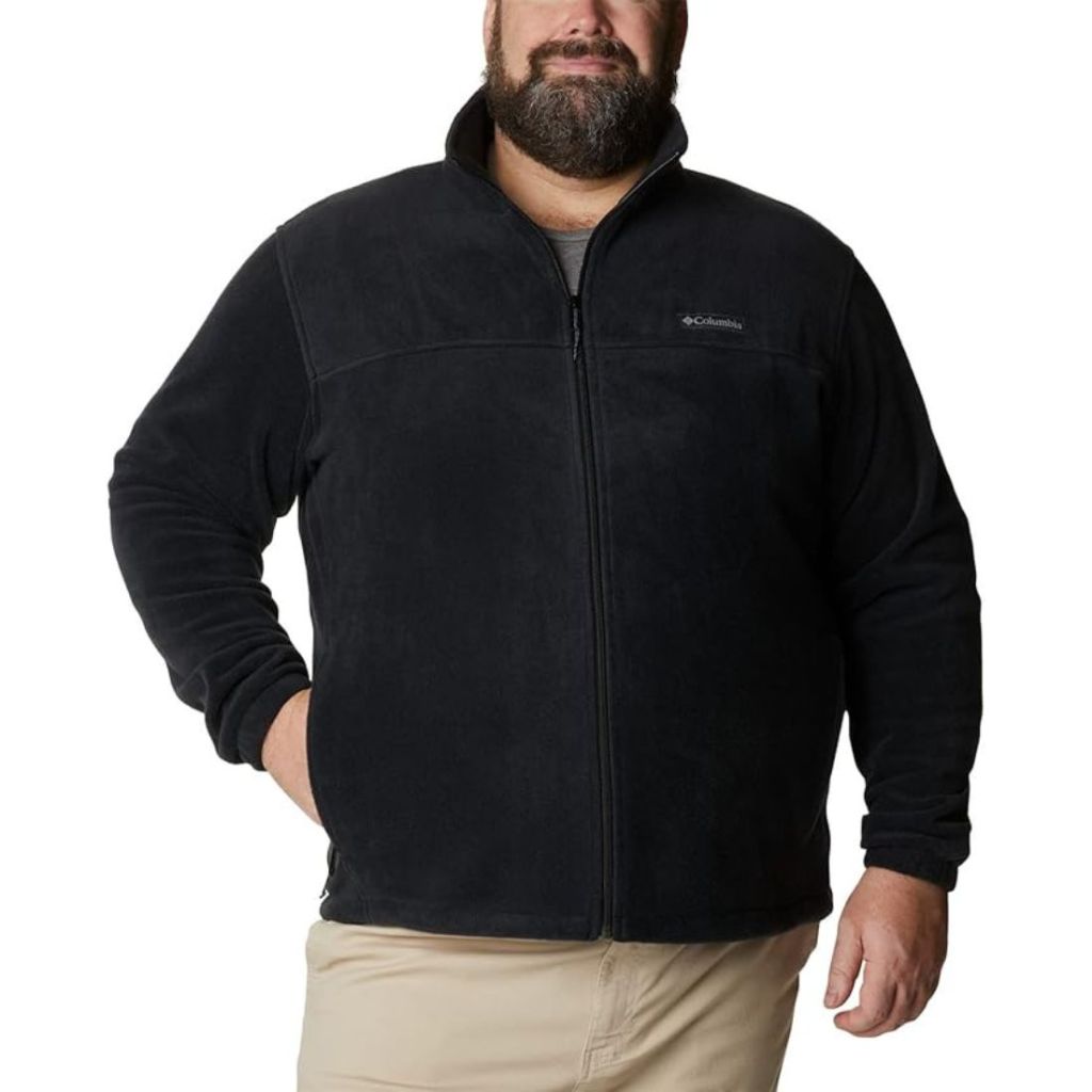 model wearing black fleece jacket and khakis