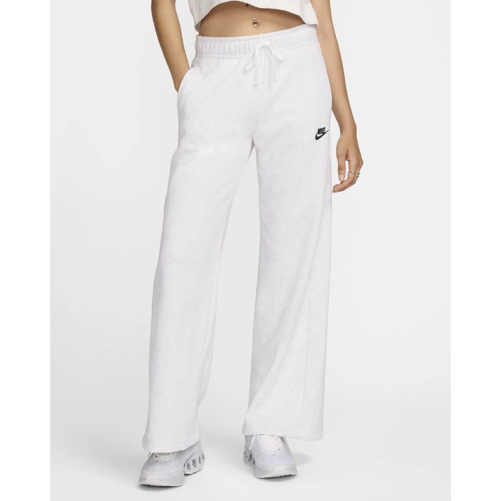 model wearing nike white wide-leg sweatpants